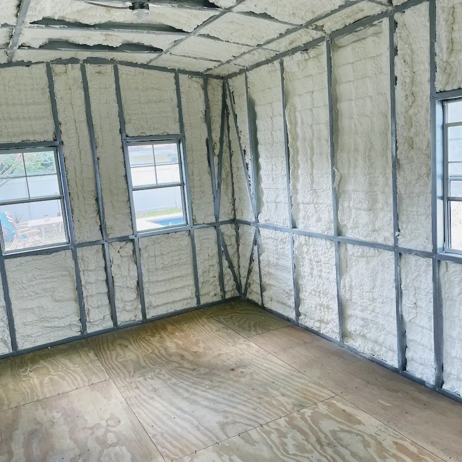 Closed-cell spray foam insulation applied to wall cavities in a residential project in DeWitt